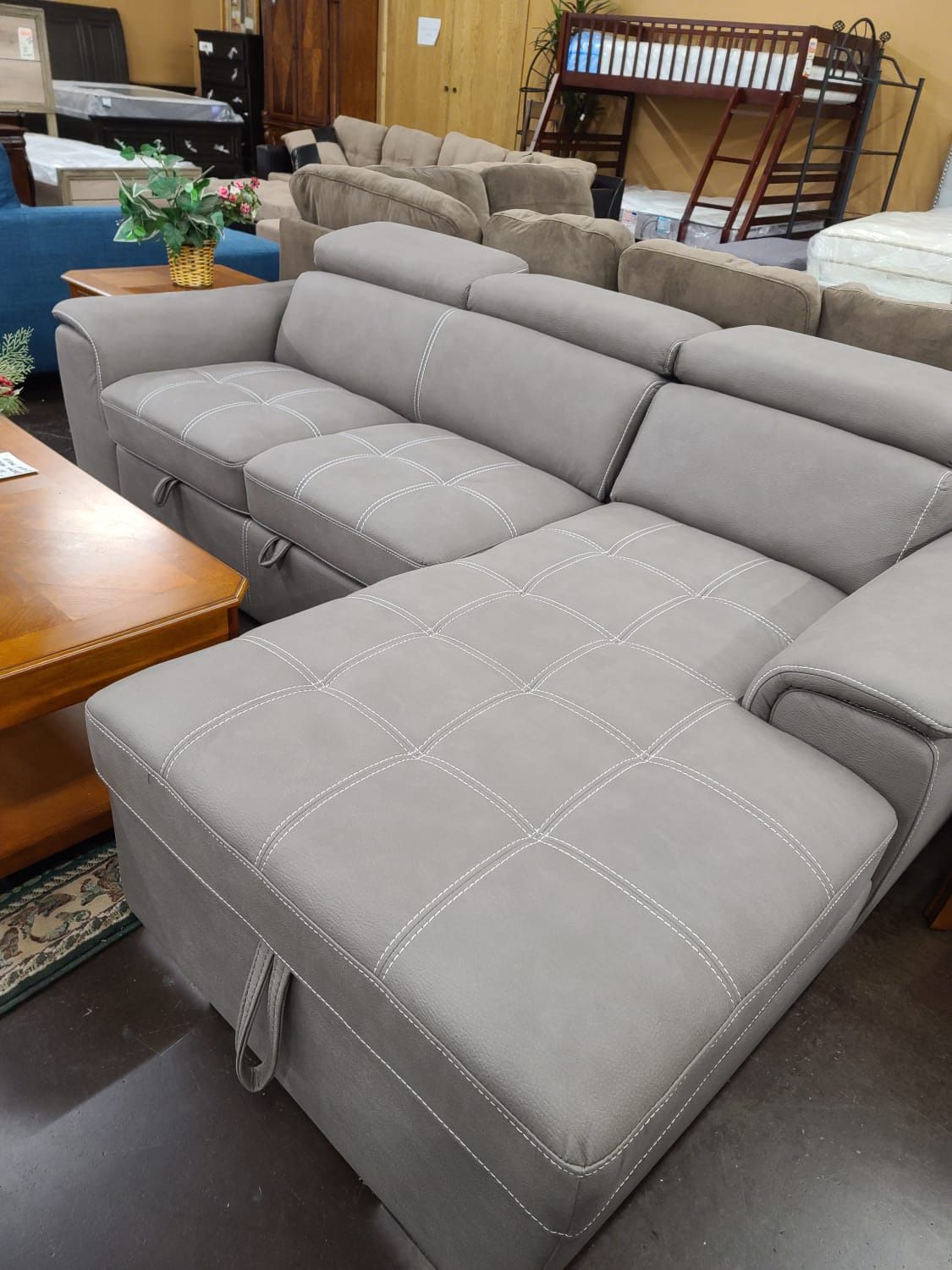 Sofa bed sectional with a storage chaise and pullout bed