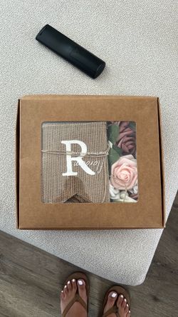 Gender reveal banner and fake flowers