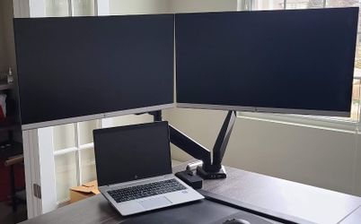 GENTLY USED DUAL MONITOR DESK ARMS