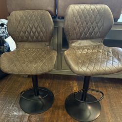 2 Bar Stools That Swivel And Adjust 