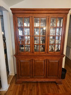 Wood table and matching china cabinet