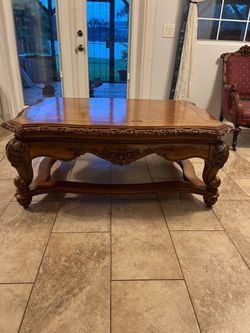 Beautiful ornate carved wood coffee table.