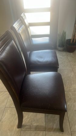 Three wood leather chairs