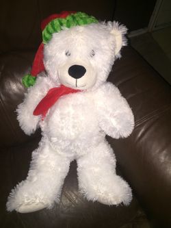 Bear lights up all different colors and plays music .