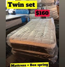 Twin size pillow top mattress with box spring