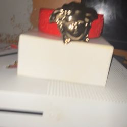 Red Versace belt with Gold Medusa Logo