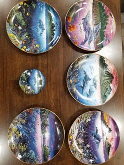 The Danbury Mint: 11 Collectors plate set by Robert Lyn Nelson + music box