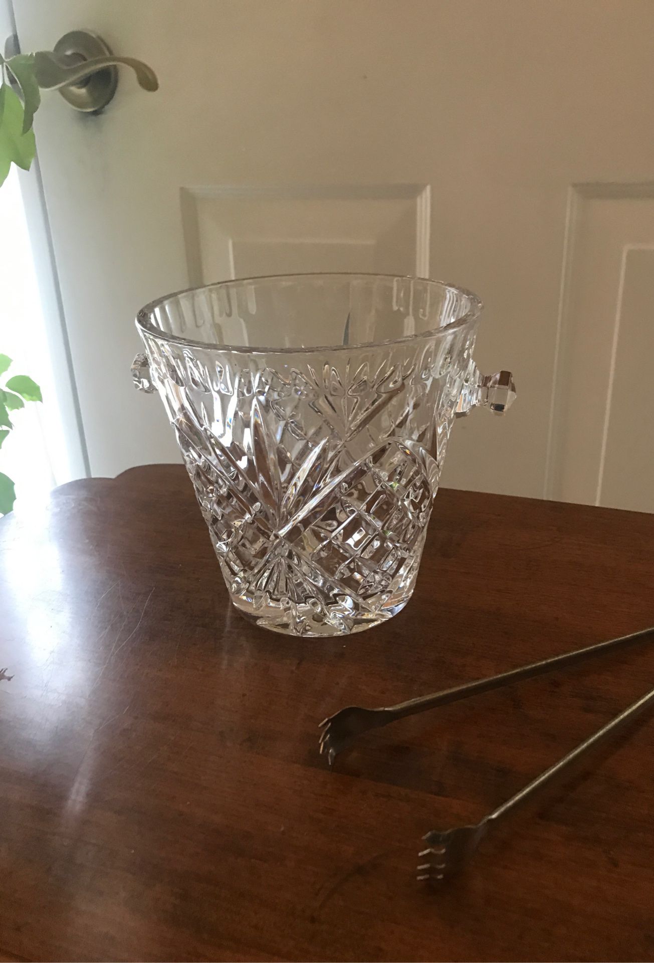 Crystal Ice Cube Bucket with silver grabbers all together for one price it is in Beautiful condition .It is 5.1/2” Tall by 5.7/8” Wide