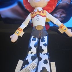 The Disney Pixar Toy Story 17" Jessie Plush Stuffed Cowgirl Doll is a collectible plush toy based on the character Jess from the Toy Story franchise. 
