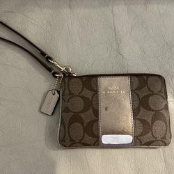 COACH Corner Zip Wristlet In Signature Canvas With Stripe