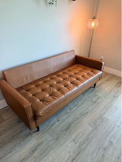 Brown faux leather two seat couch