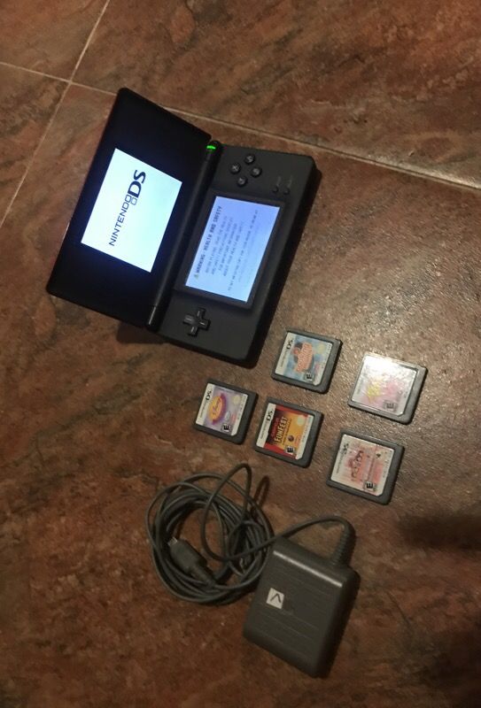 Nintendo ds with games and charger