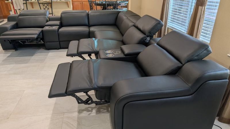 New 8 Piece / 4 PWR Reclining Sectional. Genuine Italian Leather. 123” X 151” X 35”H. Free Delivery!