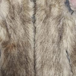 This is a Victoria's Secret Moda International faux fur vest with a shell face of 100% acrylic and a shell back and lining of 100% polyester. 