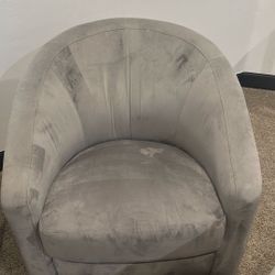 One gray reclining and swivel armchairs