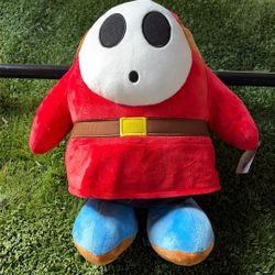 This is a Nintendo Super Mario Shy Guy plush toy