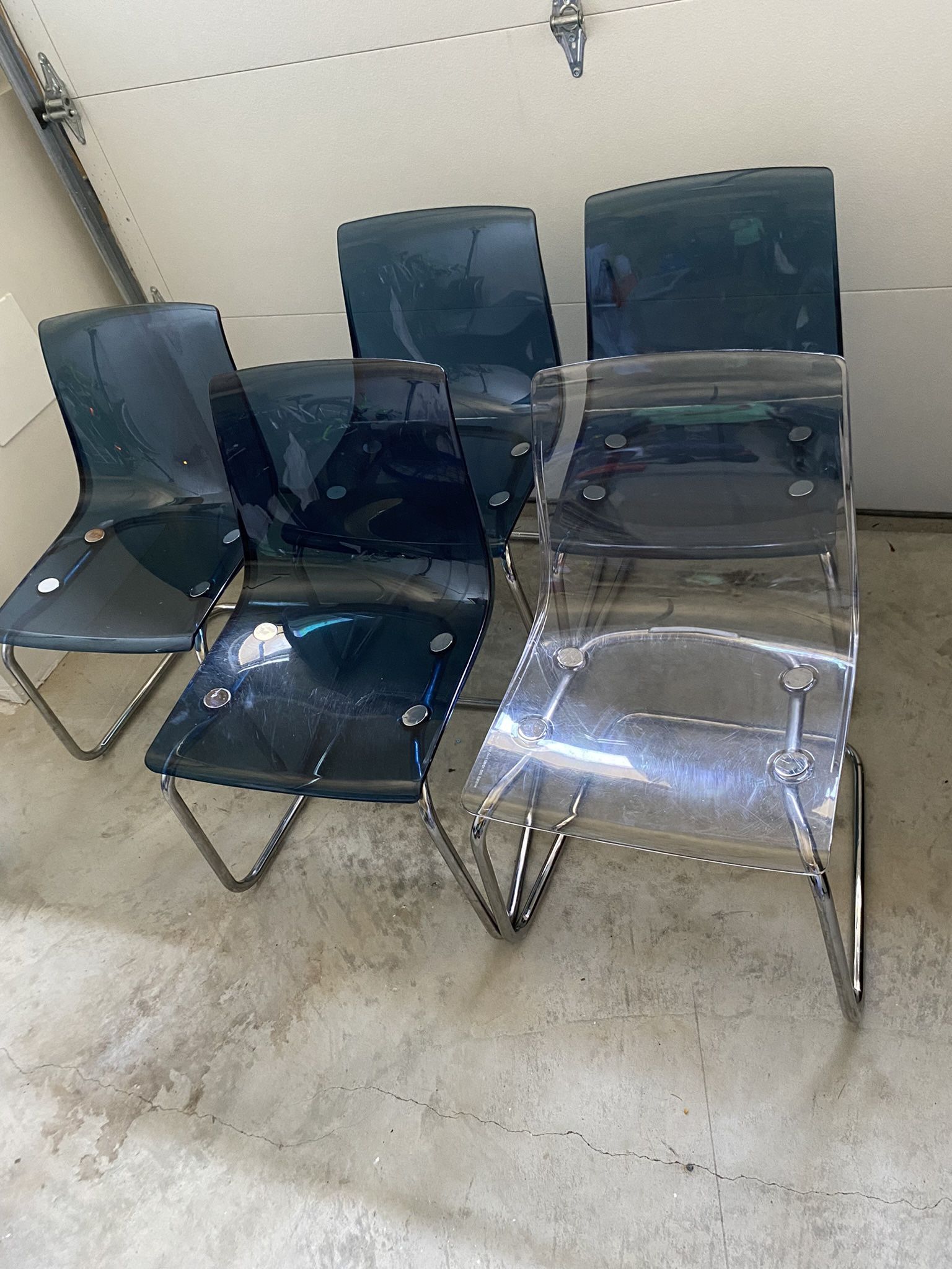 Ikea Tobias 4 blue and 1 clear chairs