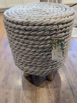 Woven stool with wooden legs