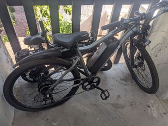 Two e-bikes with chargers