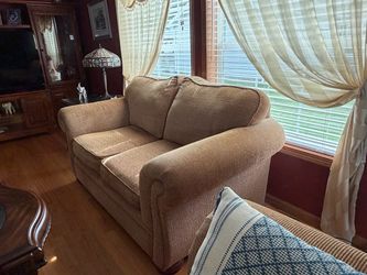 Love seat with reversible bottom cushions
