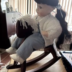 Collectible doll on rocking horse