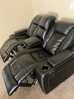 Black leather Power Reclining couches