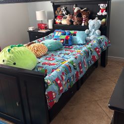 A full-size bed with It’s furniture 