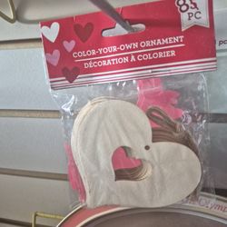 Color Your Own Ornament" heart-shaped wooden cutouts.
