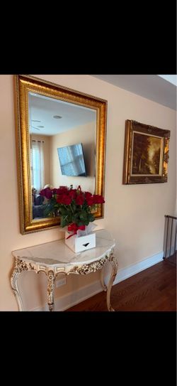 Marble top console with gold frame mirror