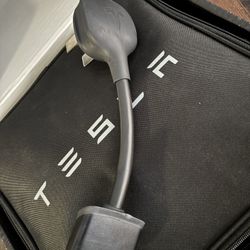 Tesla NEMA 14-50 Gen 2 Mobile Connector adapter.   	•	 