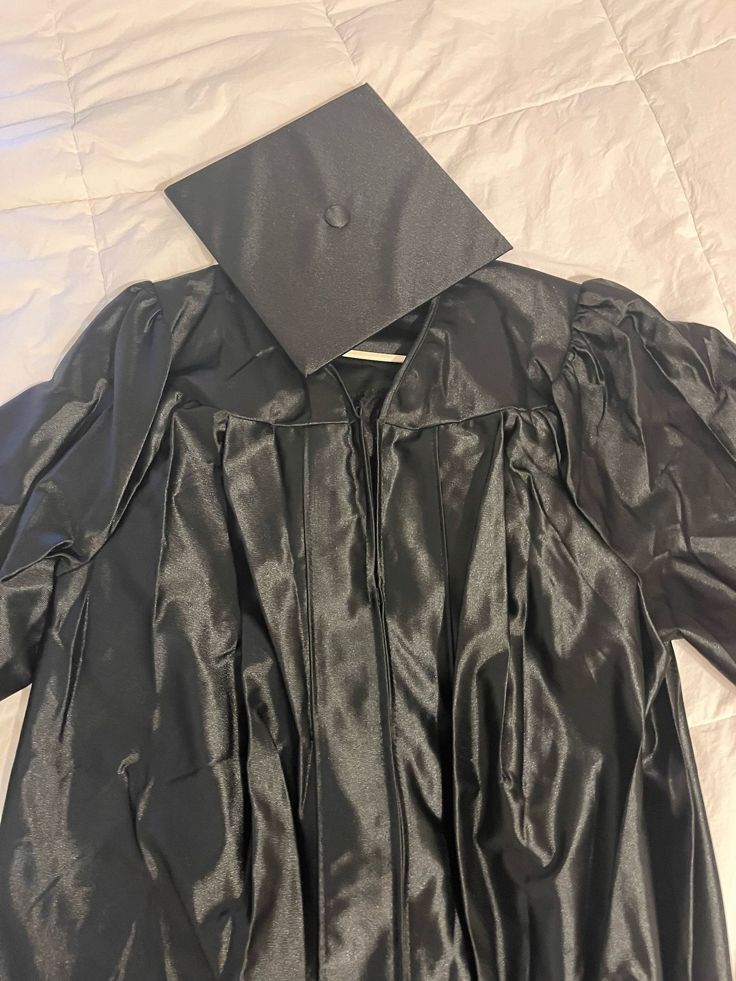 Black Cap And Graduation Gown 
