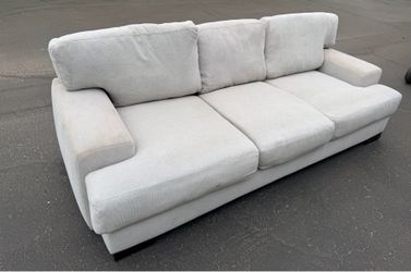 95” Gray upholdered living spaces couch