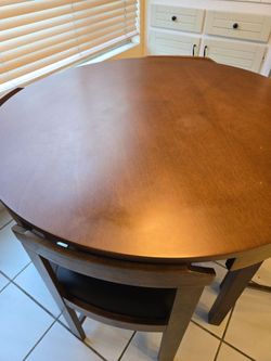 5 Piece Space-Saving Round Dining Set in a walnut finish