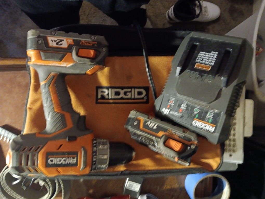 Rigid drill with two batteries in charge