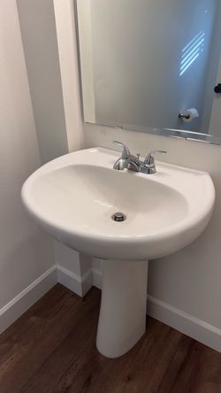 White Ceramic Pedestal Sink with Faucet and mirror