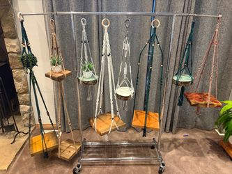 Assorted macrame plant hangers with shelves