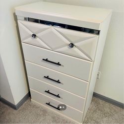 Ashley Furniture Dreamur Five Drawer Chest in a champagne finish.