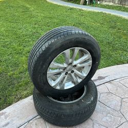 2 spare jeep wheels