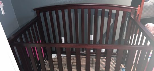 Cherry wood crib, NOT CONVERTIBLE, NO MATTRESS and changing station