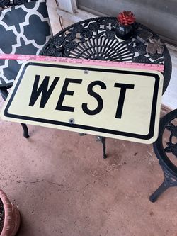 A retired Vintage Metal WEST Road Sign
