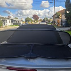 genuine Mercedes-Benz deflector assembly, also known as a wind guard or net, for a 1(contact info removed) Mercedes-Benz CLK-Class (W209)(A209) vehicl