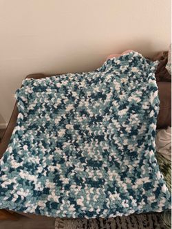 Ocean colored hand knitted blanket