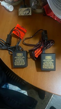 Two brand new power wheel chargers