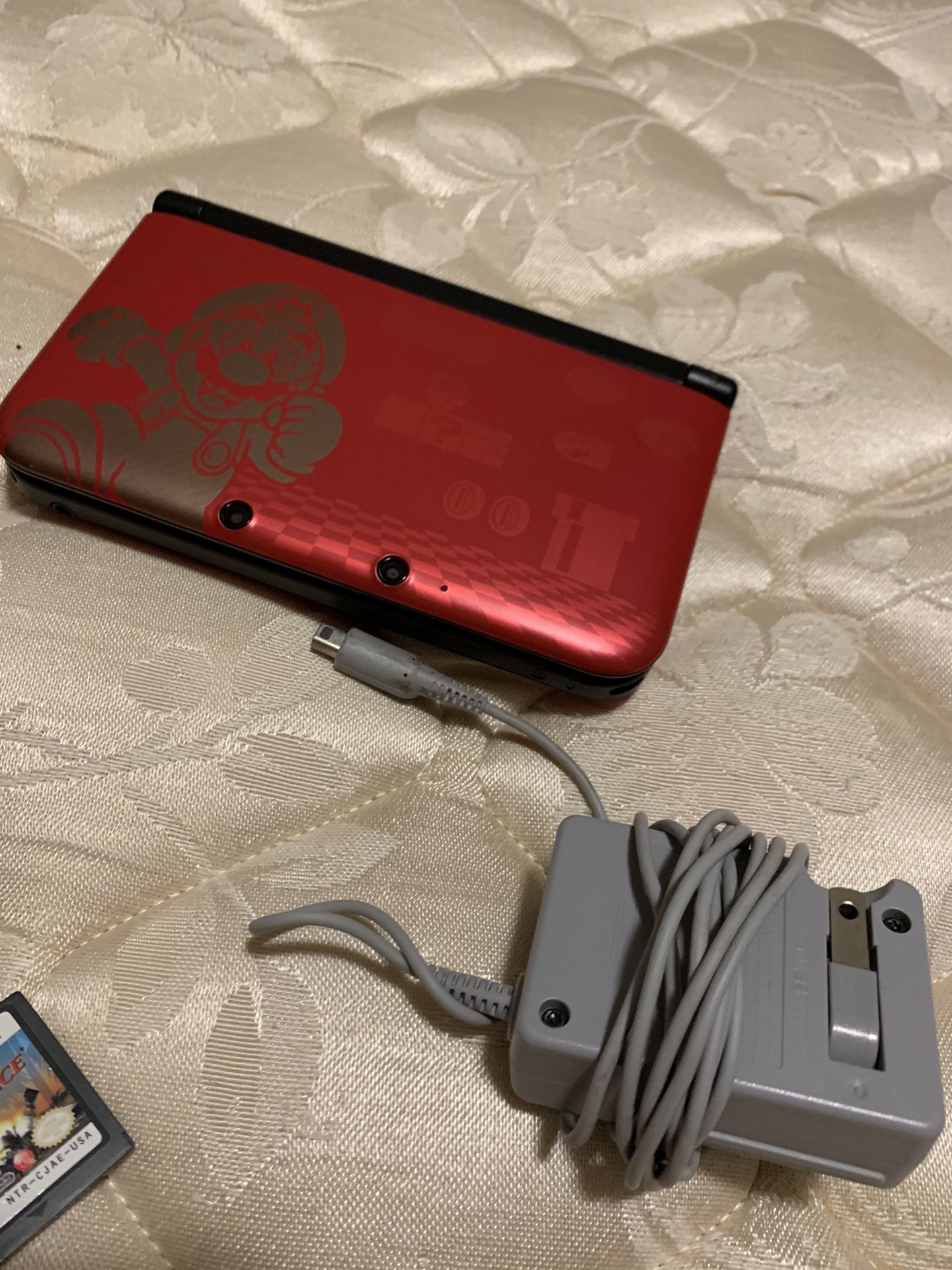 New Nintendo 3DS XL (latest model; comes with charger and 2 games)