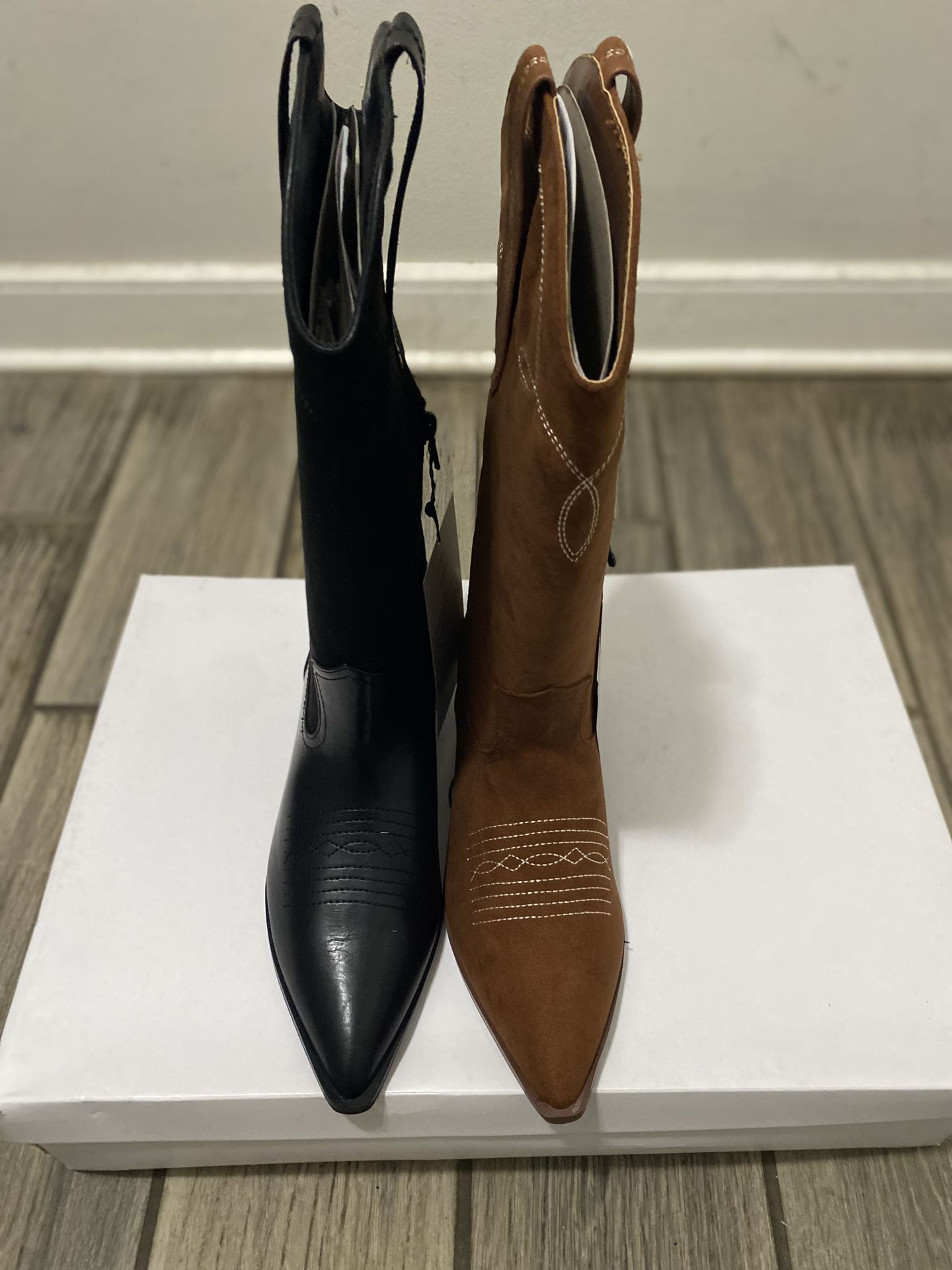 $20 each! Women cowboy boots new in box! Black 9 & 10… brown. 8.5