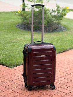 Rolling suitcase- 23”H X 15”W X 9”D