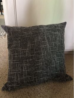 Black throw pillow with zippered cover