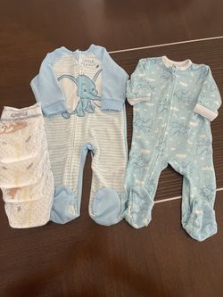 Two DISNEY footies with four Huggies Diapers(size2), 3 mo