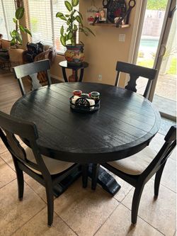 Black Round table with 4 chairs and extender from Pier 1 imports