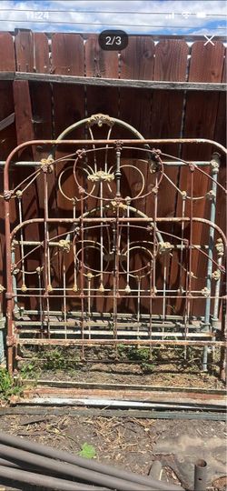 Victorian-era antique cast iron bed frame